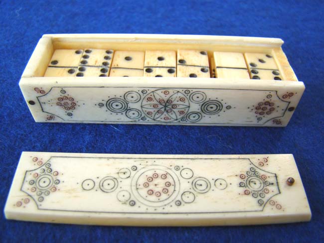 A miniature bone Domino set in a scrimed bone box, 19th century.